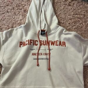 Pacific Sunwear Off-White Hoodie with Red Text